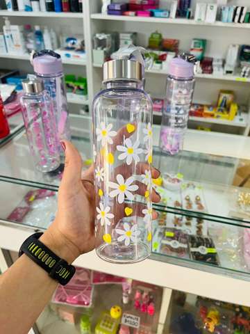 Botella con flores blancas/amarillas