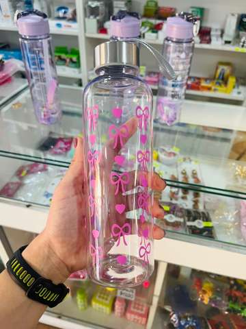 Botella con moños/corazones rosas