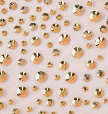 Pack de piedritas/strass dorado para la cara
